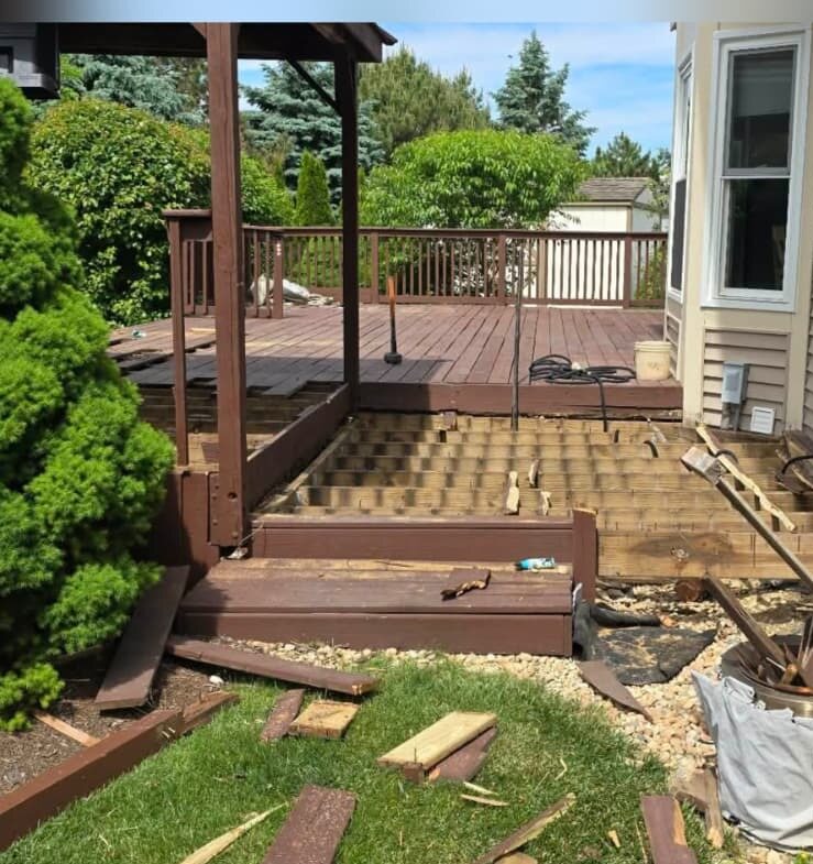 Before: aging wood deck being demolished