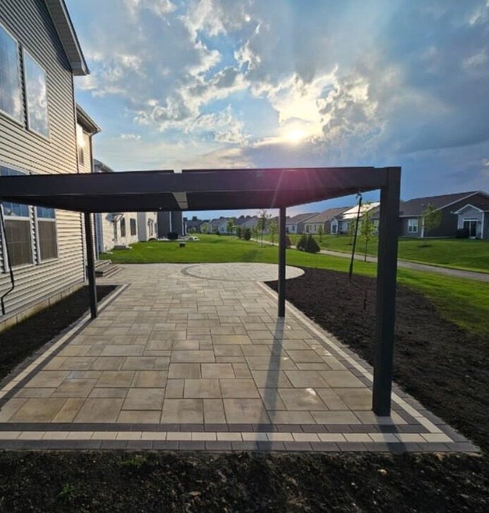 After: pergola and paver patio at sunset