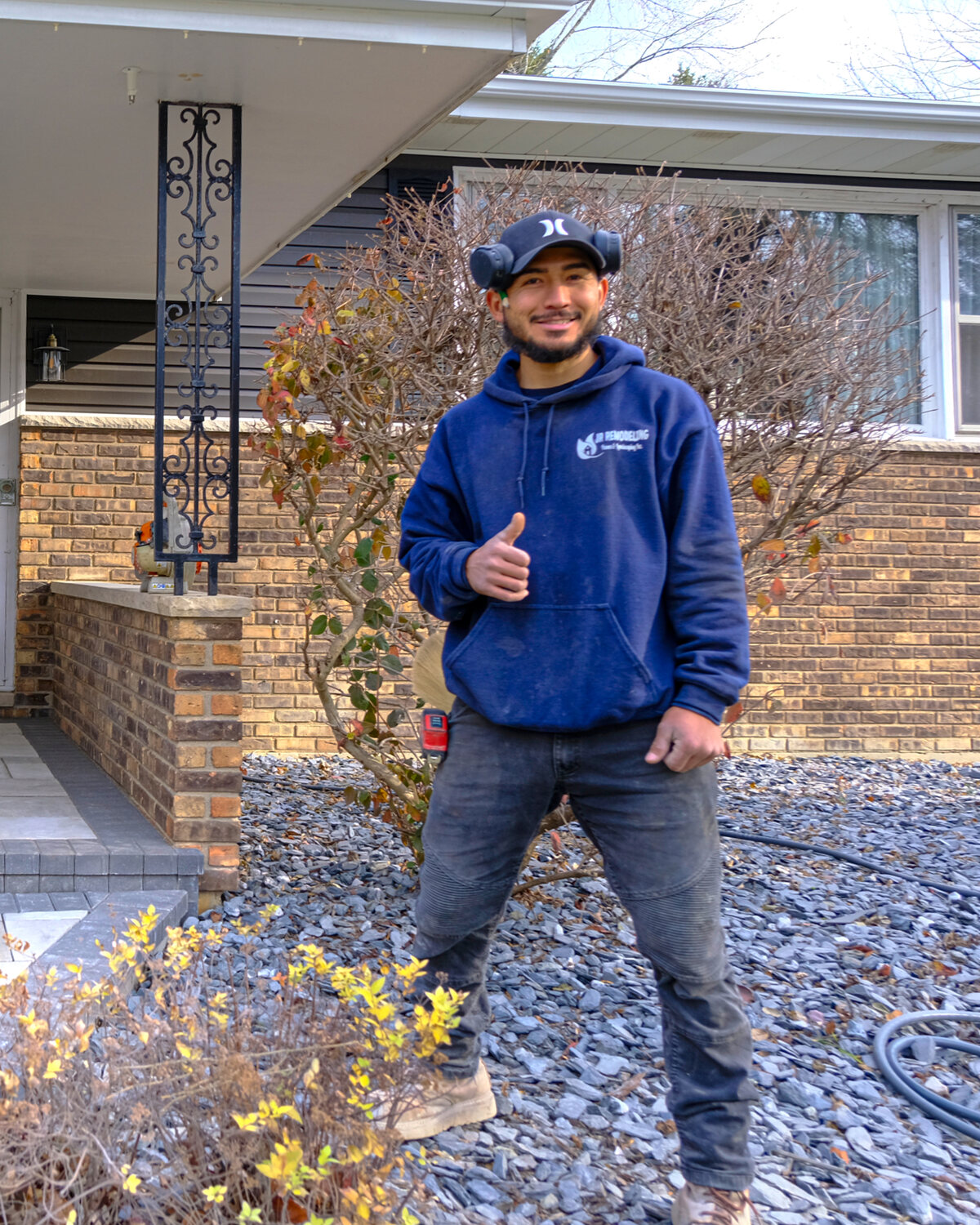 Tony, owner of JR Pavers & Landscaping, in front of a finished paver entry